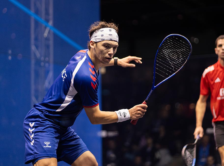 French squash player Victor Crouin competing on court